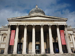 The entrance portico facing onto Trafalgar Square. The inscription was added during refurbishment work on the building in 2004&ndash;5.[41]