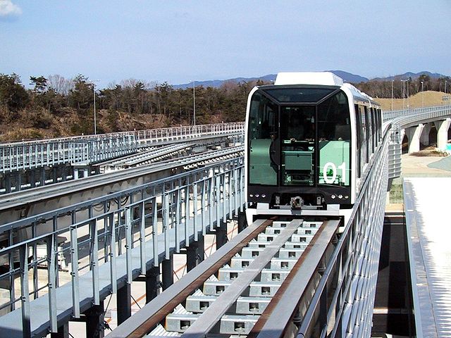 File:Linimo approaching Banpaku Kinen Koen, towards Fujigaoka Station.jpg