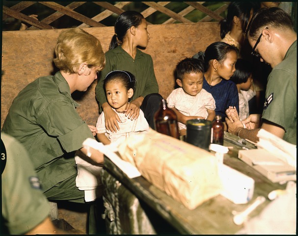 File:Second Lieutenant Kathleen M. Sullivan treats a Vietnamese child during Operation MED CAP, a U.S. Air Force civic... - NARA - 542331.tif