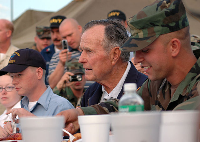 File:US Navy 051008-N-9274T-001 After arriving on board Naval Air Station Joint Reserve Base (NAS JRB), New Orleans, former President George H. Bush sits down to eat with military personnel.jpg