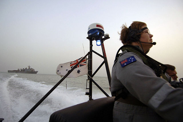 File:US Navy 050704-N-4309A-443 Australian Petty Officer ET Tarah Clark, stationed aboard the guided missile armed frigate HMAS Newcastle (FFG 06), drives a Rigid Hull Inflatible Boat (RHIB) back to her ship after making a passenger.jpg